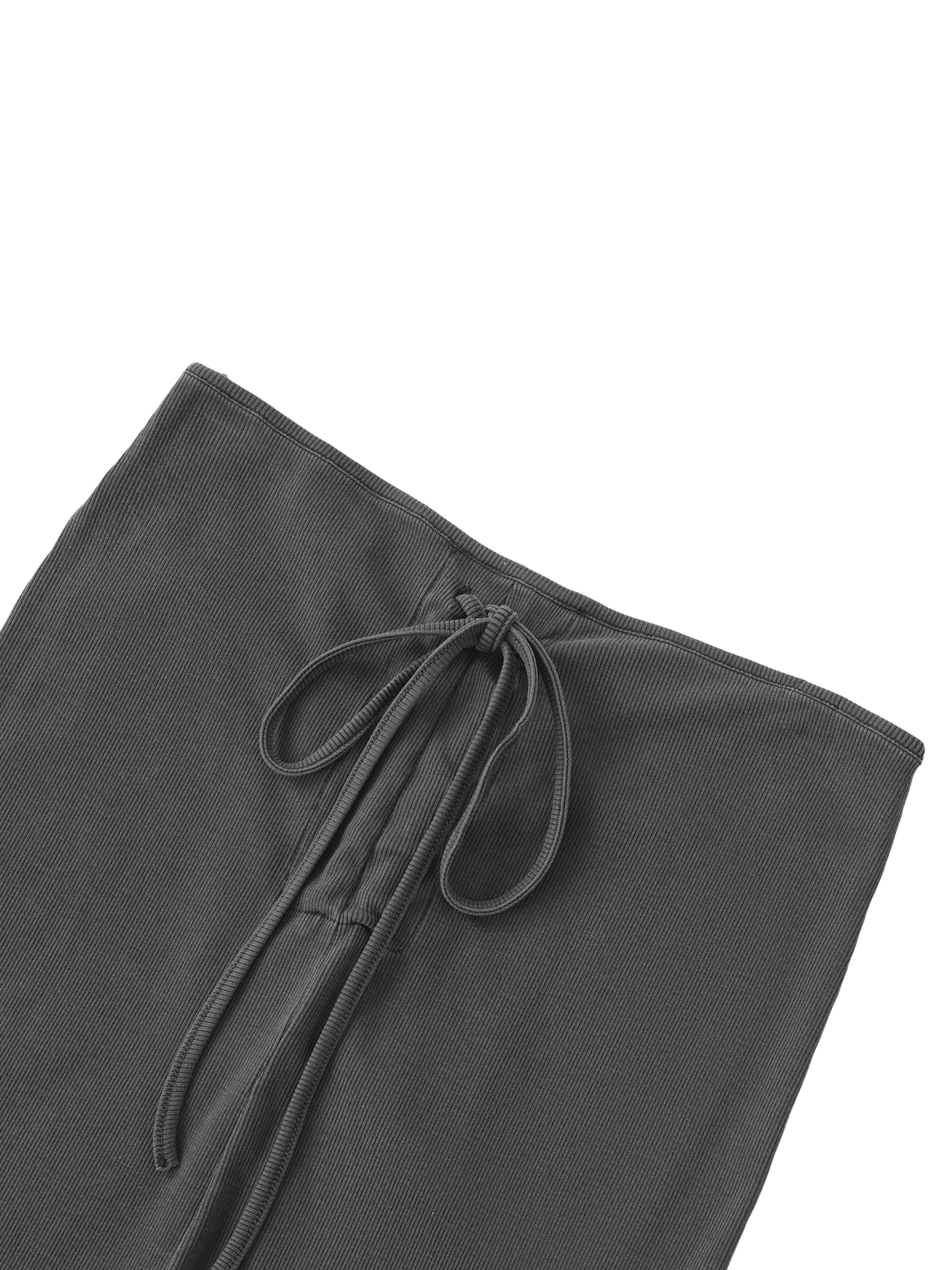 Close-up of the adjustable drawstring waist and vintage dyed-wash fabric texture.